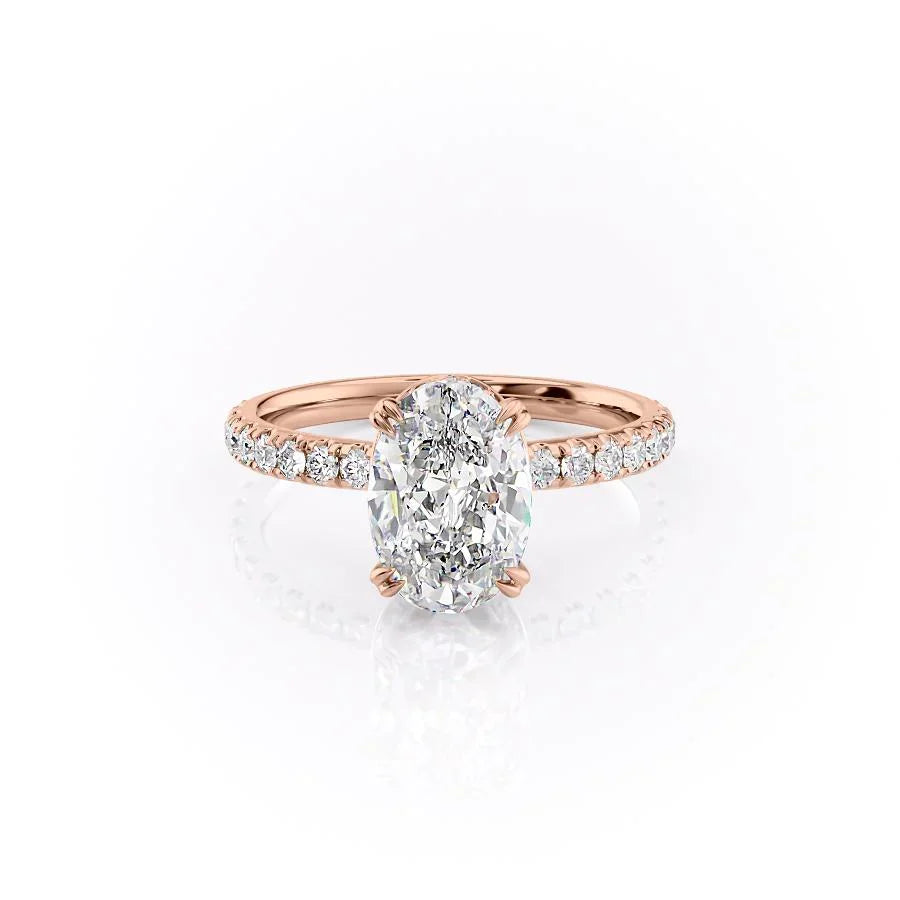 The Sofia. A Rose Gold Pave, Hidden Halo Engagement Ring Set With A 2ct Oval Lab Grown Diamond. White Background.