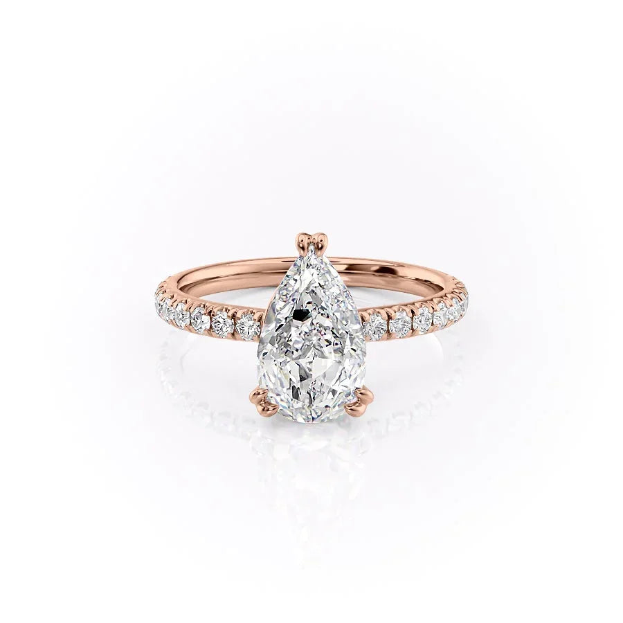 The Sofia. A Rose Gold Pave, Hidden Halo Engagement Ring Set With A 2ct Pear Lab Grown Diamond. White Background.