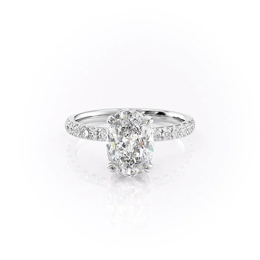 The Sofia. A White Gold Pave, Hidden Halo Engagement Ring Set With A 2ct Oval Lab Grown Diamond. White Background.