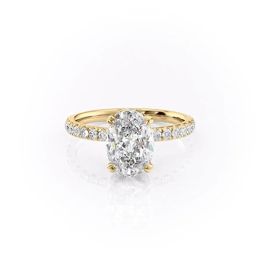 The Sofia. A Yellow Gold Pave, Hidden Halo Engagement Ring Set With A 2ct Oval Lab Grown Diamond. White Background.