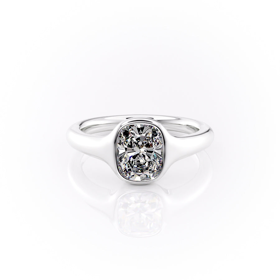 The Stella. A White Gold Vintage, Solitaire Engagement Ring Set With A 2ct Elongated Cushion Lab Grown Diamond. White Background.