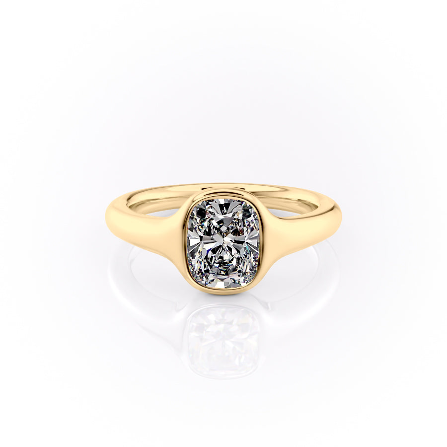 The Stella. A Yellow Gold Vintage, Solitaire Engagement Ring Set With A 2ct Elongated Cushion Lab Grown Diamond. White Background.