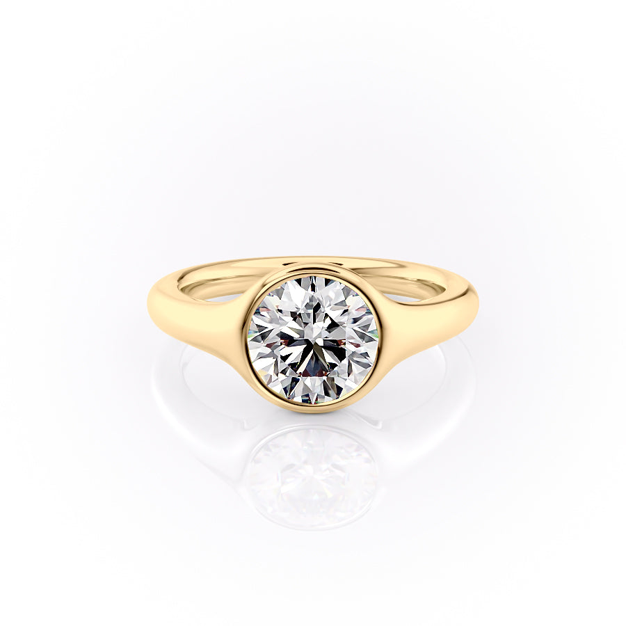 The Stella. A Yellow Gold Vintage, Solitaire Engagement Ring Set With A 2ct Round Lab Grown Diamond. White Background.