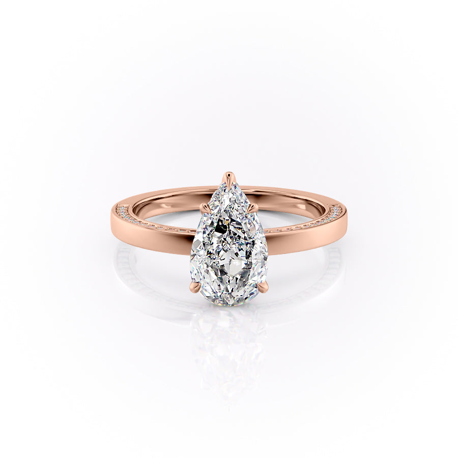 The Sydney. A Rose Gold Hidden Halo, Solitaire, Pave Engagement Ring Set With A 2ct Pear Lab Grown Diamond. White Background.