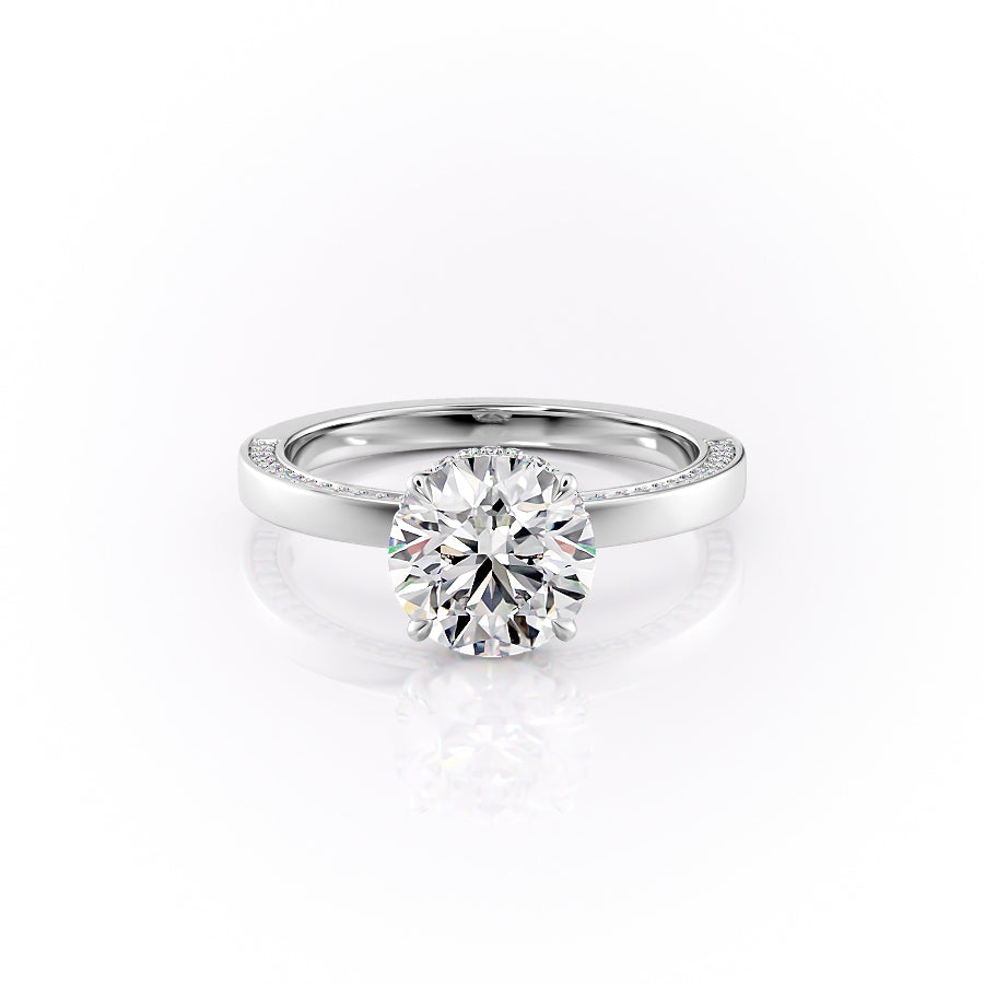 The Sydney. A White Gold Hidden Halo, Solitaire, Pave Engagement Ring Set With A 2ct Round Lab Grown Diamond. White Background.