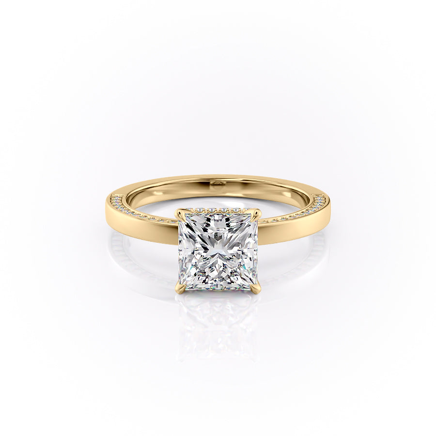 The Sydney. A Yellow Gold Hidden Halo, Solitaire, Pave Engagement Ring Set With A 2ct Princess Lab Grown Diamond. White Background.
