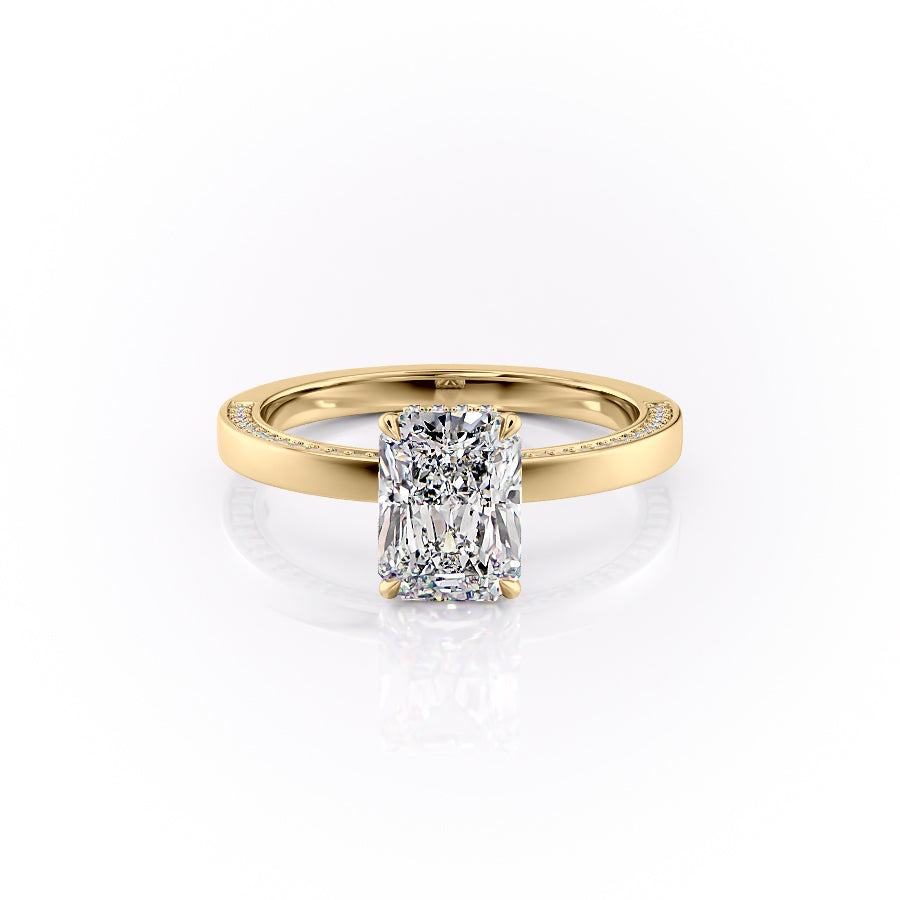 The Sydney. A Yellow Gold Hidden Halo, Solitaire, Pave Engagement Ring Set With A 2ct Radiant Lab Grown Diamond. White Background.