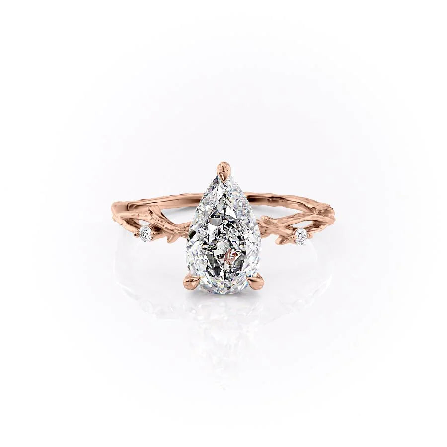 The Textured Twig. A Rose Gold Solitaire, Nature, Three Stone, Side Stones Engagement Ring Set With A 2ct Pear Lab Grown Diamond. White Background.
