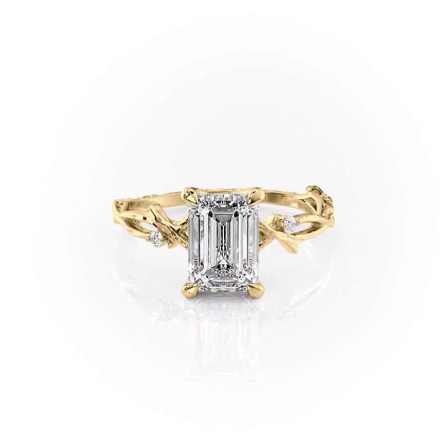 The Textured Twig. A Yellow Gold Solitaire, Nature, Three Stone, Side Stones Engagement Ring Set With A 2ct Emerald Lab Grown Diamond. White Background.