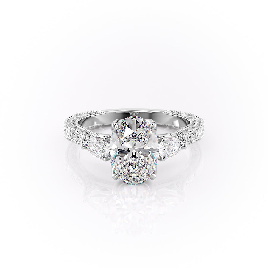 The Three Stone Sierra. A White Gold Vintage Engagement Ring Set With A 2ct Oval Lab Grown Diamond. White Background.