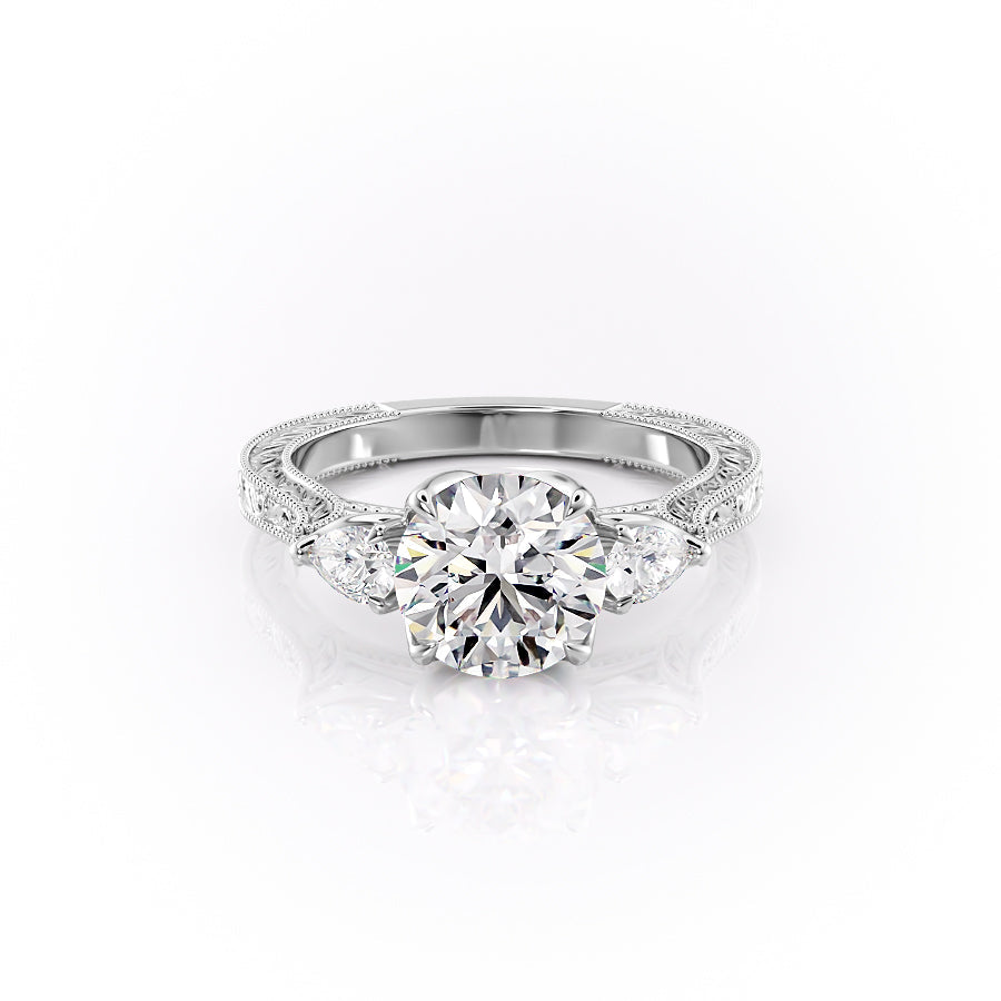 The Three Stone Sierra. A White Gold Vintage Engagement Ring Set With A 2ct Round Lab Grown Diamond. White Background.