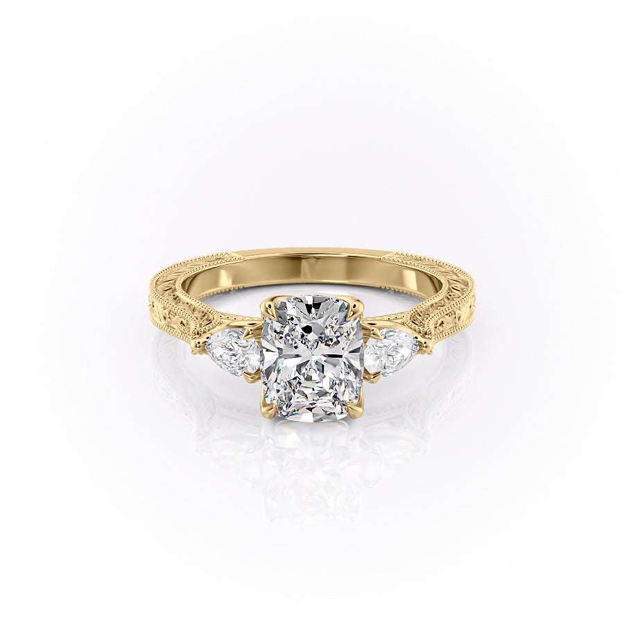 The Three Stone Sierra. A Yellow Gold Vintage Engagement Ring Set With A 2ct Elongated Cushion Lab Grown Diamond. White Background.