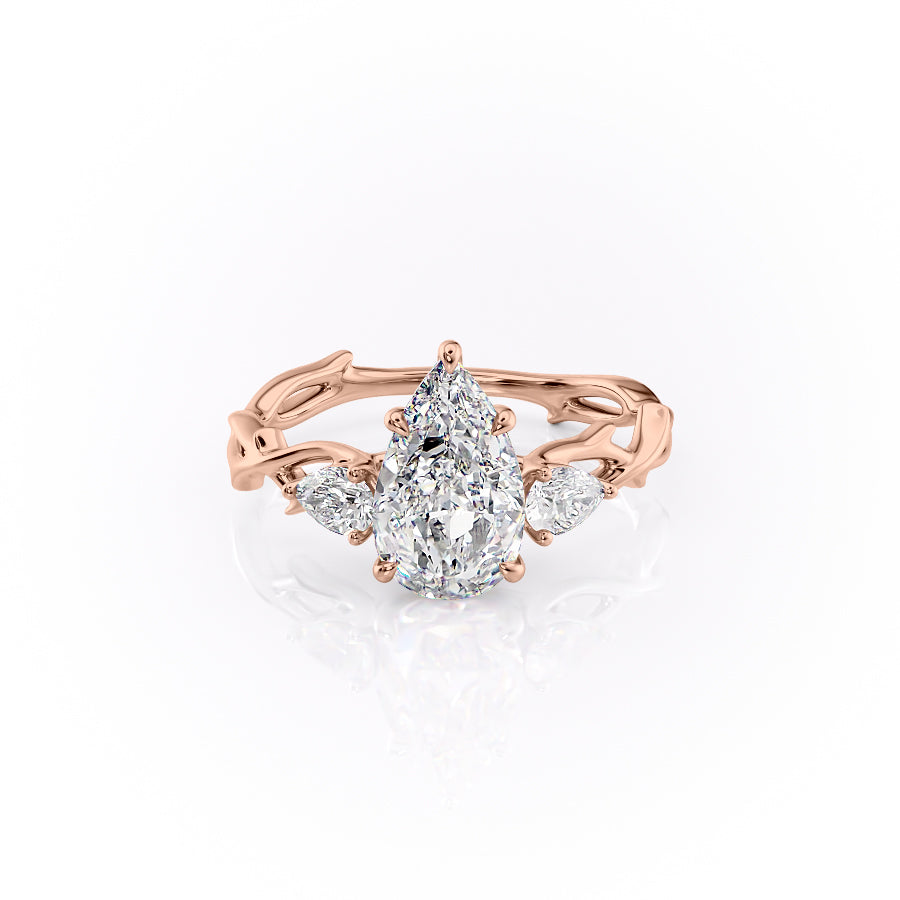 The Three Stone Twig. A Rose Gold Nature Engagement Ring Set With A 2ct Pear Lab Grown Diamond. White Background.