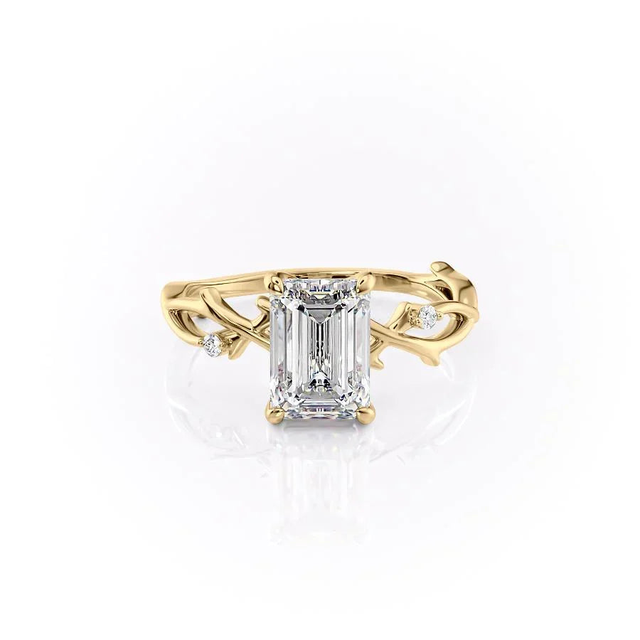 The Twig. A Yellow Gold Solitaire, Nature, Three Stone, Side Stones Engagement Ring Set With A 2ct Emerald Lab Grown Diamond. White Background.