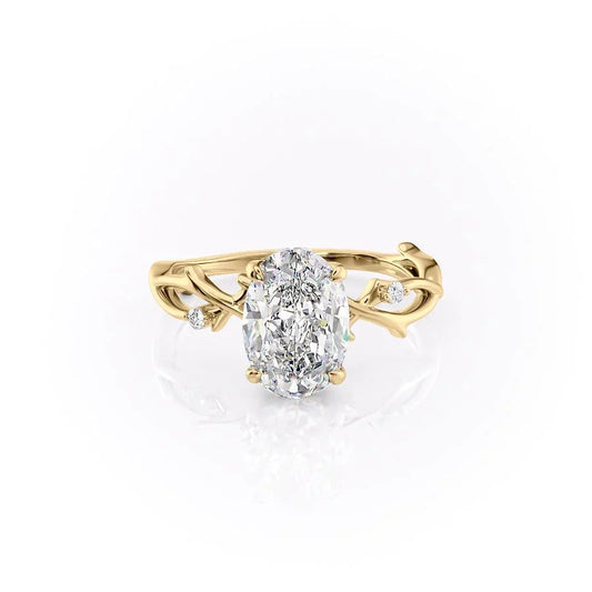 The Twig. A Yellow Gold Solitaire, Nature, Three Stone, Side Stones Engagement Ring Set With A 2ct Oval Lab Grown Diamond. White Background.