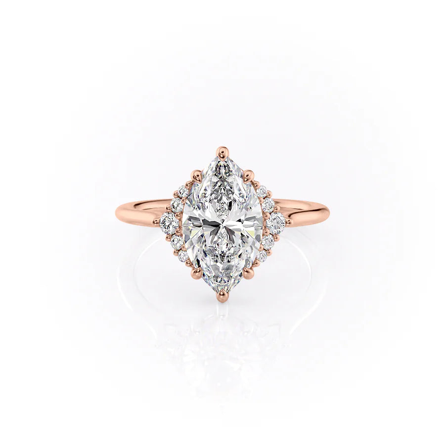 The Victoria. A Rose Gold Three Stone, Side Stones Engagement Ring Set With A 2ct Marquise Lab Grown Diamond. White Background.