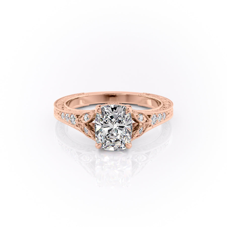 The Violet. A Rose Gold Vintage, Side Stones Engagement Ring Set With A 2ct Elongated Cushion Lab Grown Diamond. White Background.