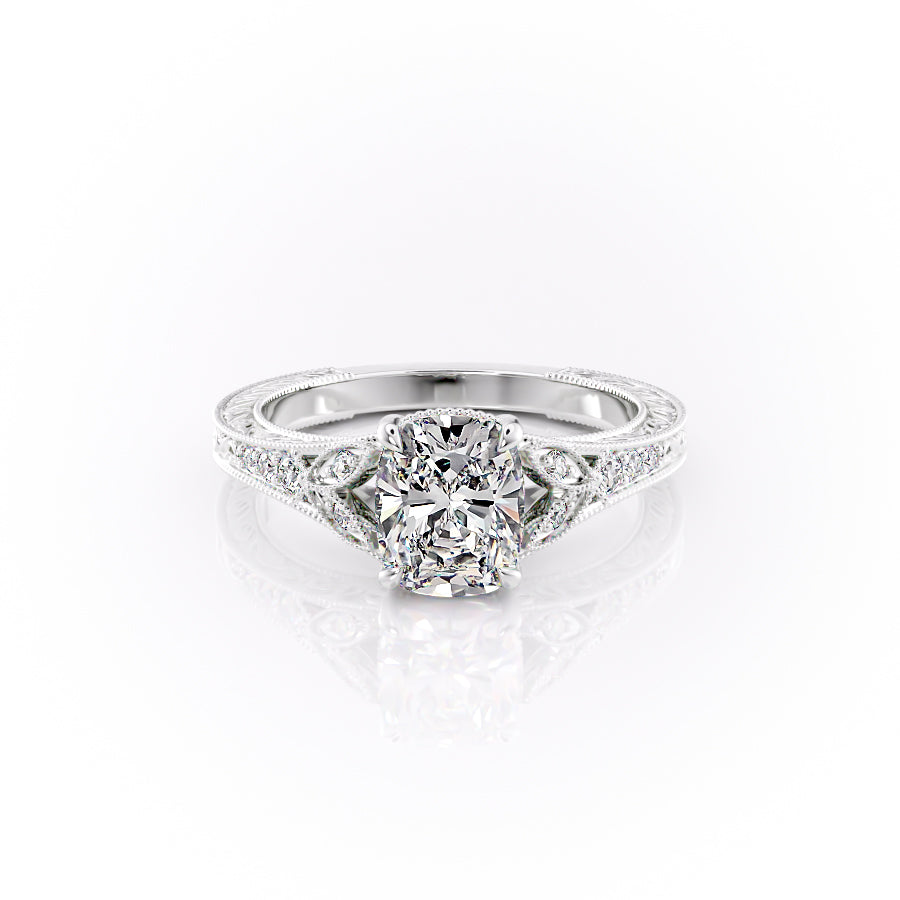The Violet. A White Gold Vintage, Side Stones Engagement Ring Set With A 2ct Elongated Cushion Lab Grown Diamond. White Background.