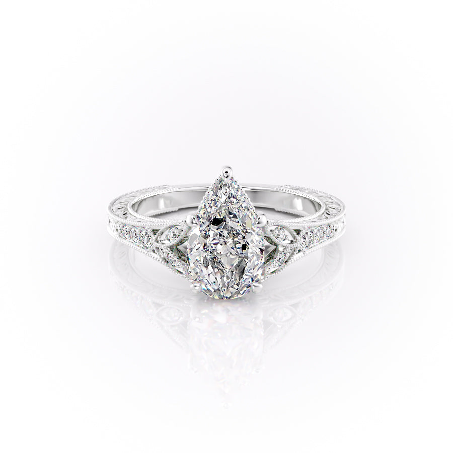 The Violet. A White Gold Vintage, Side Stones Engagement Ring Set With A 2ct Pear Lab Grown Diamond. White Background.