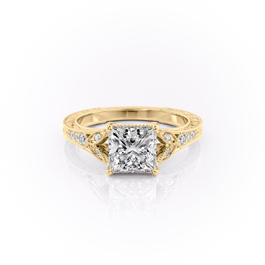 The Violet. A Yellow Gold Vintage, Side Stones Engagement Ring Set With A 2ct Princess Lab Grown Diamond. White Background.
